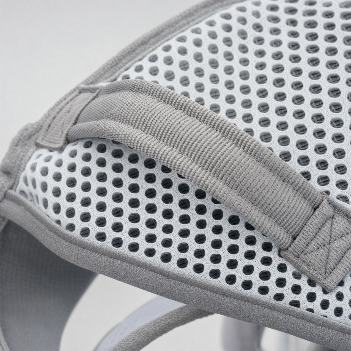 Close-up of the grab handle stitched to the air-mesh back panel